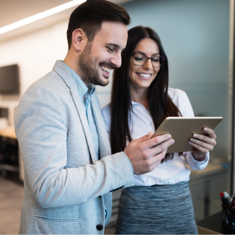 man and woman on tablet