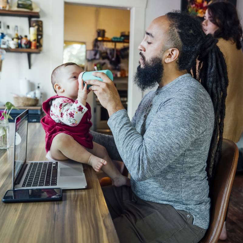 Dad feeding child