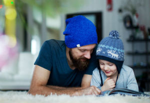 dad and son reading a book