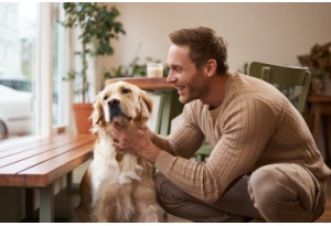 man at home with his dog