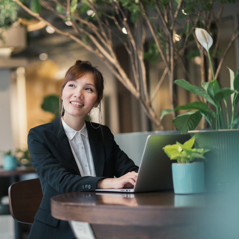 asian woman on laptop