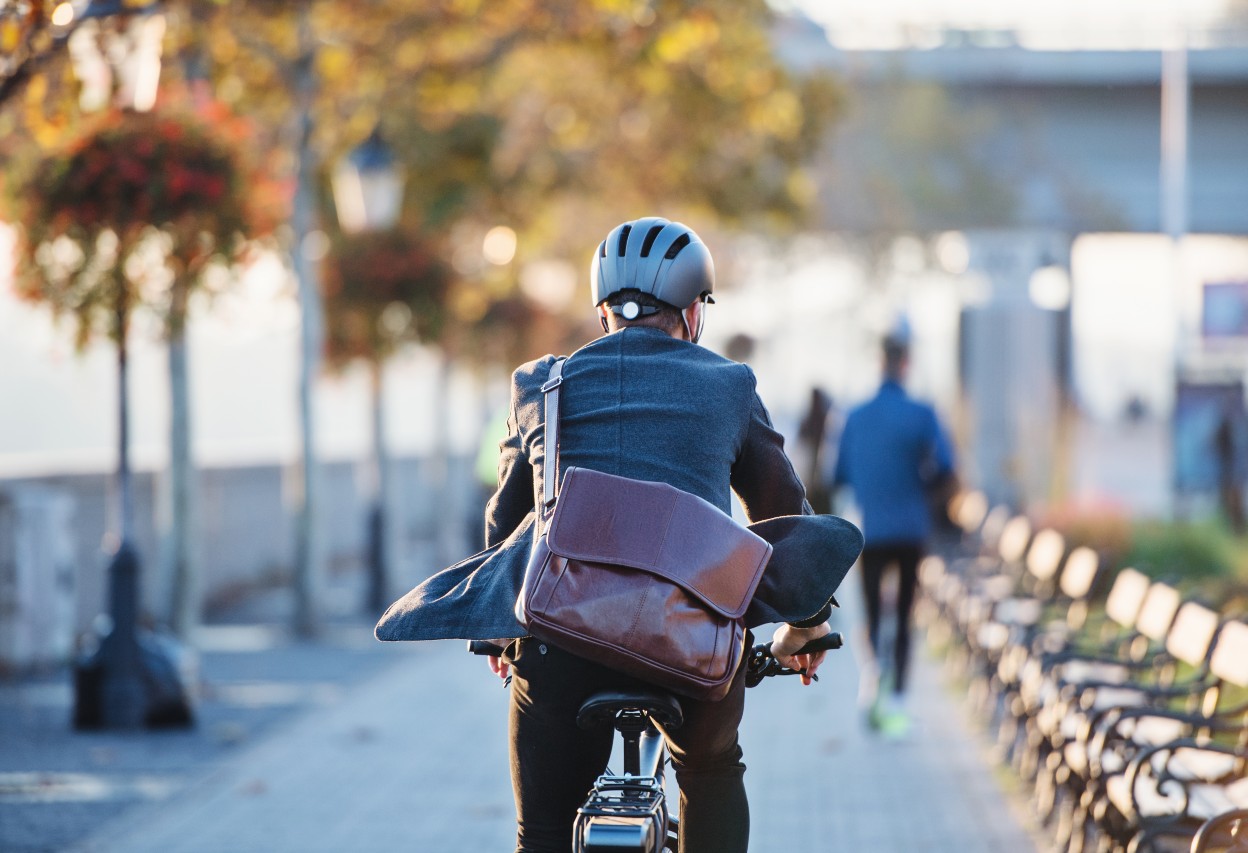 employee cycling to work